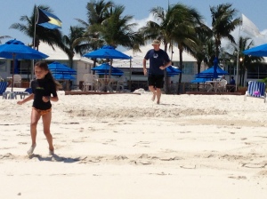 Charlotte and Dad jogging on the beach
